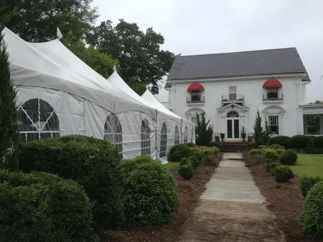 Tent wedding setup in front of the historic estate